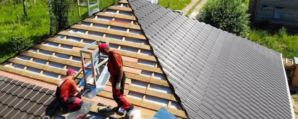 workers installing the roofing materials