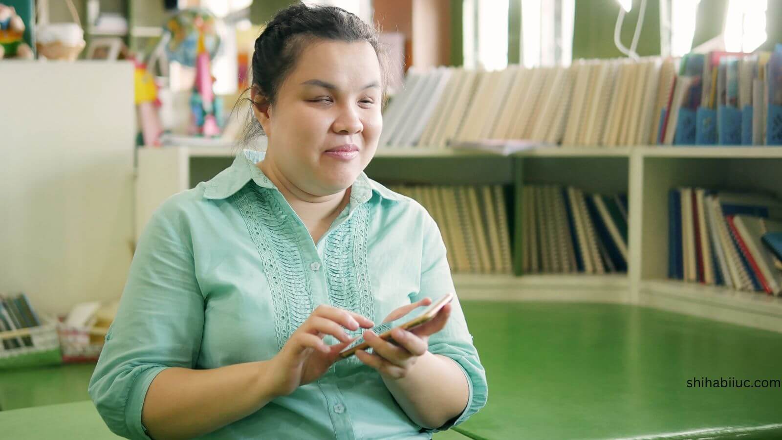 A blind woman is using mobile, accessibility